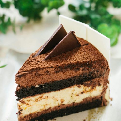 Indulge in a rich chocolate mousse cake slice, perfect for dessert lovers.